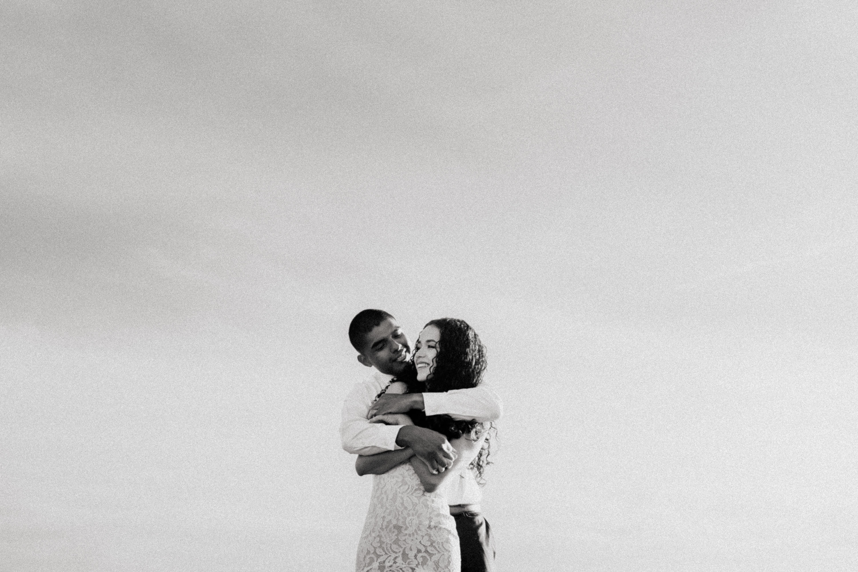 Intimate moment of closeness shared during their Treasure Island Beach engagement session.